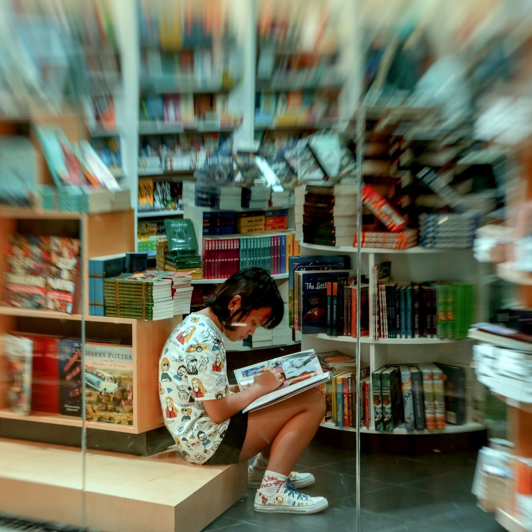 Brazilian editor reviewing printed pages at a desk